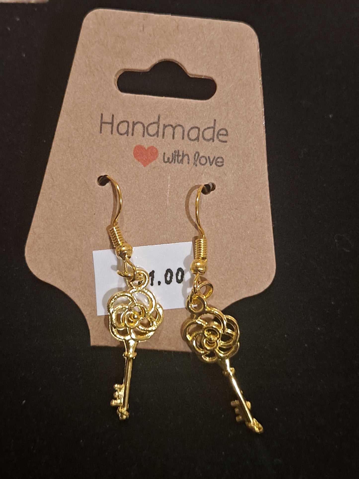 Gold tone key charm earrings